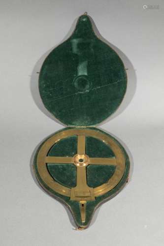 Brass surveying circle in its black Moroccan case,…