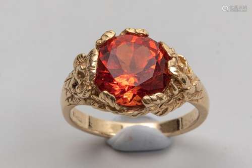 Ring in 14k yellow gold surmounted by an orange sa…