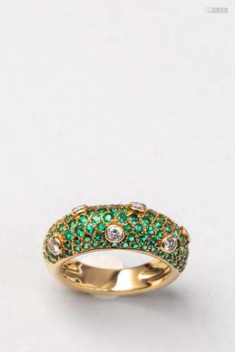 Domed ring in 18k yellow gold paved with emeralds …