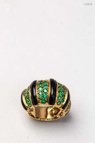 Domed ring in 18k yellow gold paved with emeralds …