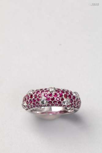 Domed ring in 18k white gold paved with rubies and…