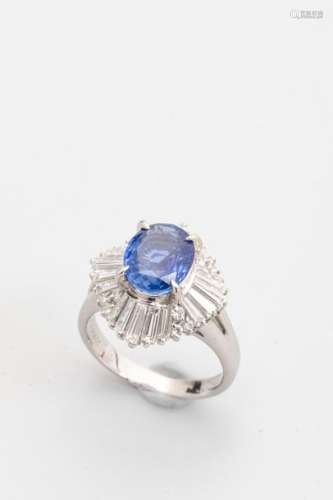 Platinum ring surmounted by an oval sapphire of CE…