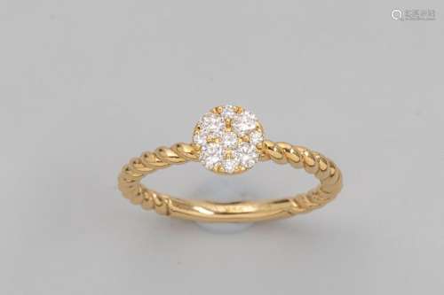 Twisted ring in 18k yellow gold surmounted by a ro…