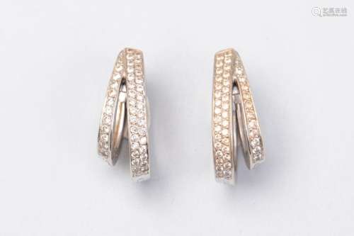 Pair of white gold earrings adorned with two lines…