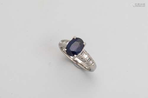 Platinum ring adorned with an oval cut sapphire of…