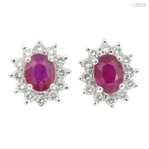 A pair of 18ct gold ruby and diamond cluster