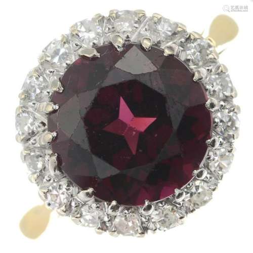 A garnet and diamond cluster ring.Garnet calculated