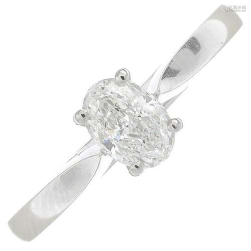 A platinum oval-cut diamond single-stone ring.With