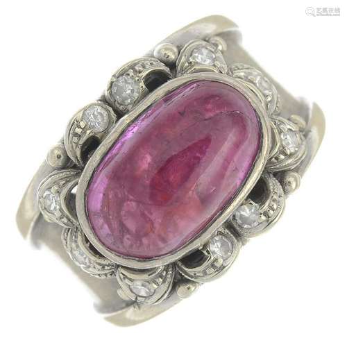 A ruby cabochon and diamond dress ring.Ruby calculated