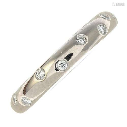 An 18ct gold diamond band ring.Total diamond weight