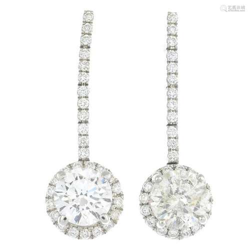 A pair of diamond drop earrings. Total principal