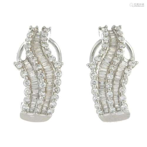 A pair of vari-cut diamond earrings.Estimated total