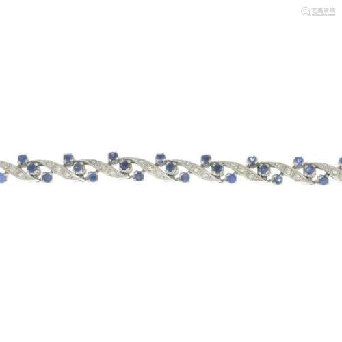 A sapphire and diamond bracelet.Estimated total diamond