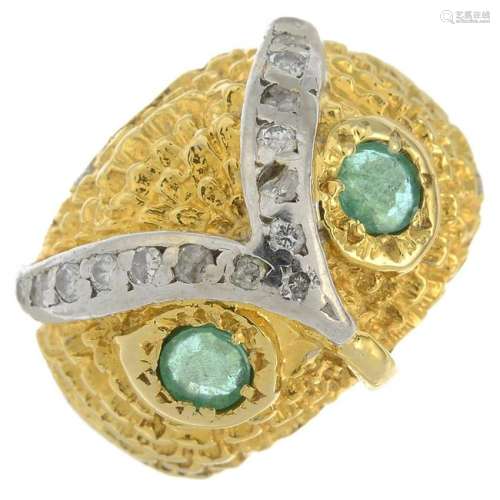 A diamond and emerald owl ring.Estimated total diamond