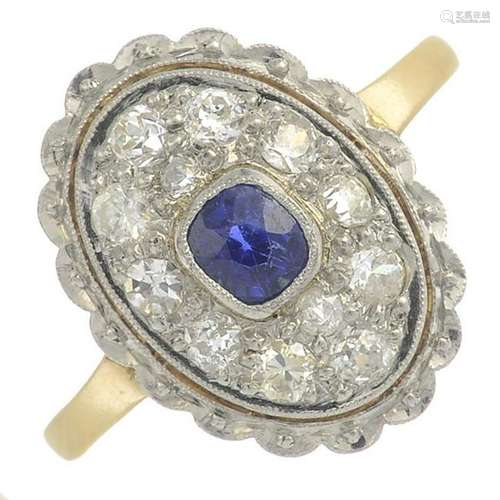 A sapphire and vari-cut diamond cluster ring.Sapphire