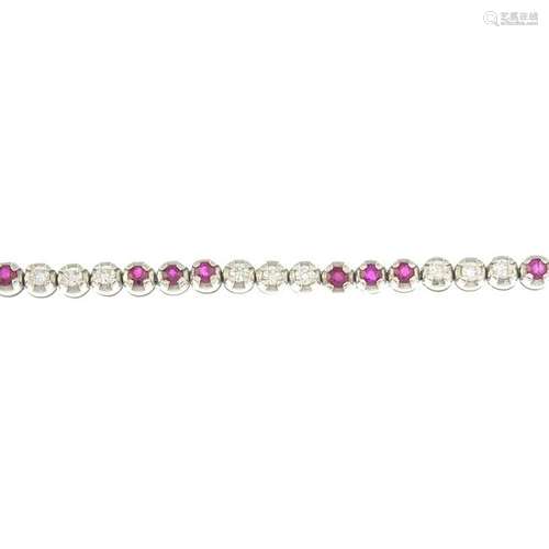 A ruby and diamond line bracelet.Estimated total