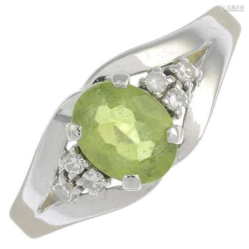 A peridot and diamond ring.Peridot calculated weight