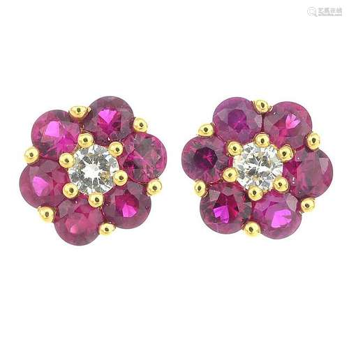 A pair of 18ct gold ruby and diamond floral cluster