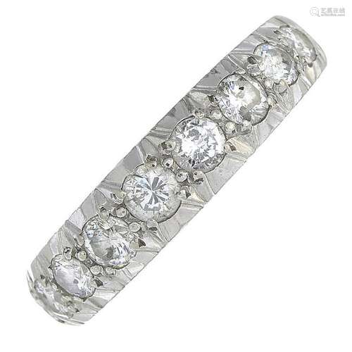 An 18ct gold diamond half eternity ring.Estimated total