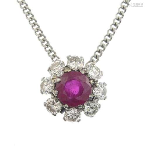 A ruby and diamond cluster pendant, with integral 18ct