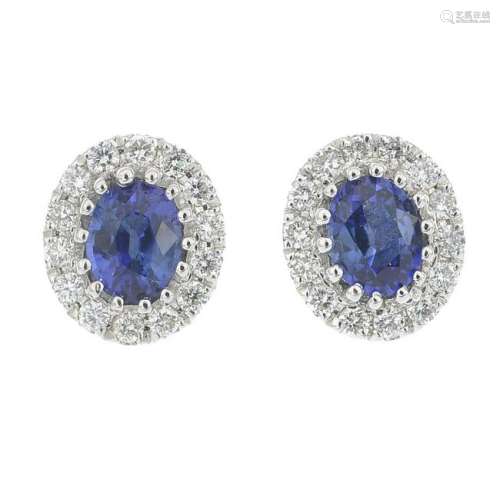 A pair of sapphire and diamond cluster earrings.Total