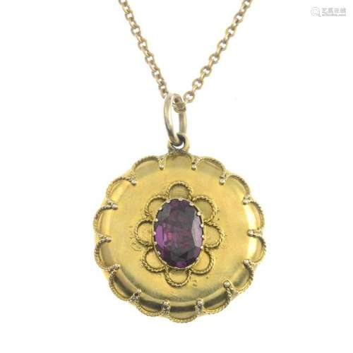 A late Victorian gold garnet single-stone pendant, with