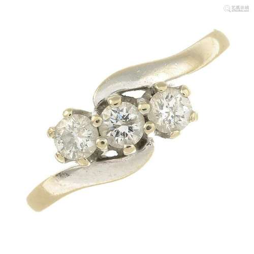 An 18ct gold brilliant-cut diamond three-stone ring.