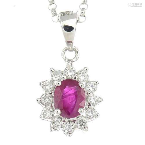 A ruby and diamond cluster pendant, suspended from an