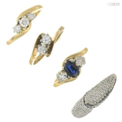 Four gold gem-set dress rings.Estimated total diamond
