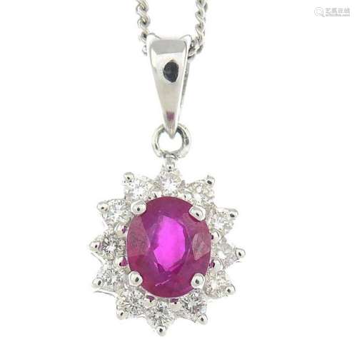 An 18ct gold ruby and diamond cluster pendant,