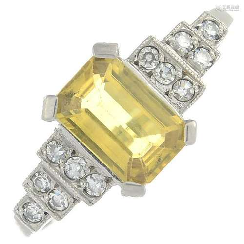 A yellow sapphire and diamond dress ring.Sapphire