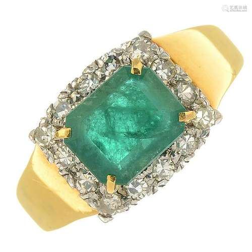 An 18ct gold emerald and diamond cluster ring.Emerald