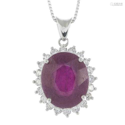 A ruby and diamond cluster pendant, suspended from a