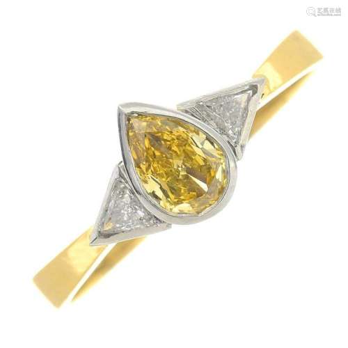 An 18ct gold diamond and 'coloured' diamond three-stone