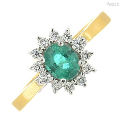 An 18ct gold emerald and diamond ring.Estimated total