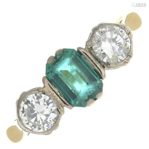 An 18ct gold emerald and diamond three-stone
