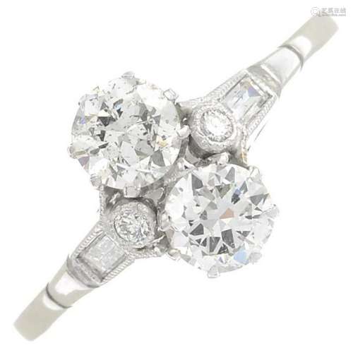 A mid 20th century platinum diamond two-stone ring,