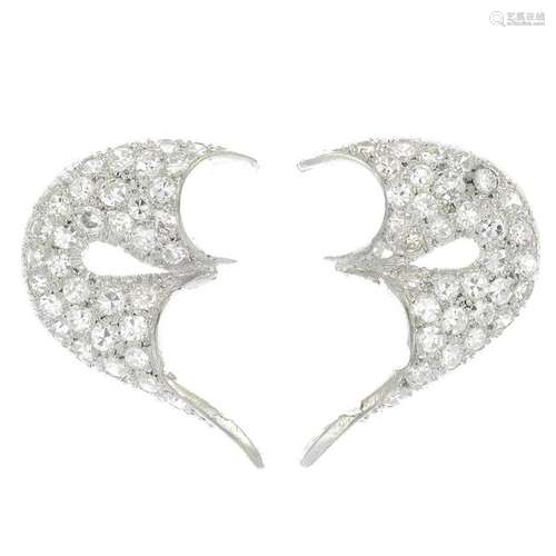 A pair of platinum diamond earrings.Estimated total