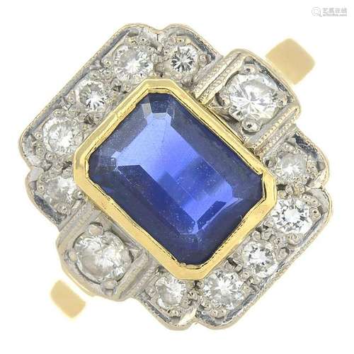 An 18ct gold sapphire and diamond cluster ring.Sapphire