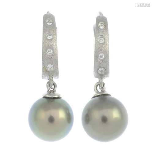 A pair of cultured pearl and diamond earrings.Cultured