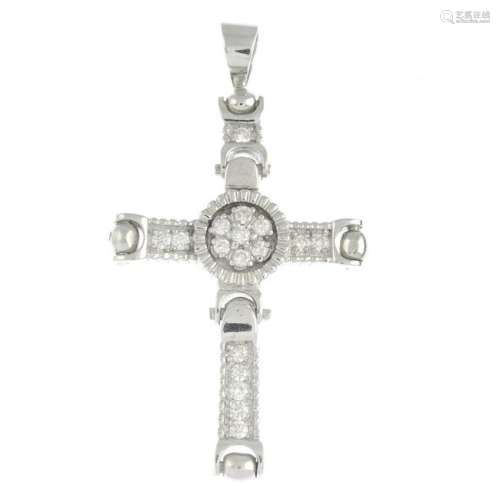 A diamond-set cross pendant.Estimated total diamond