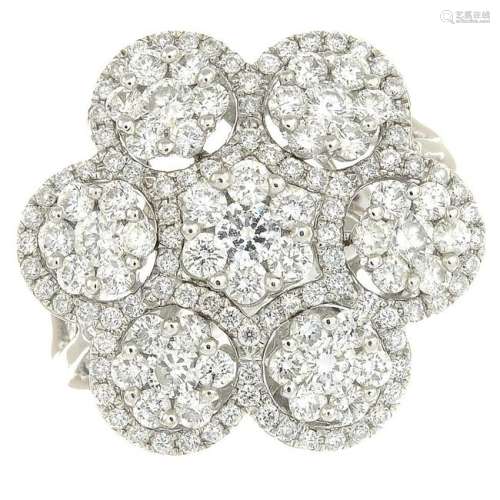 A diamond floral cluster ring.Estimated total diamond