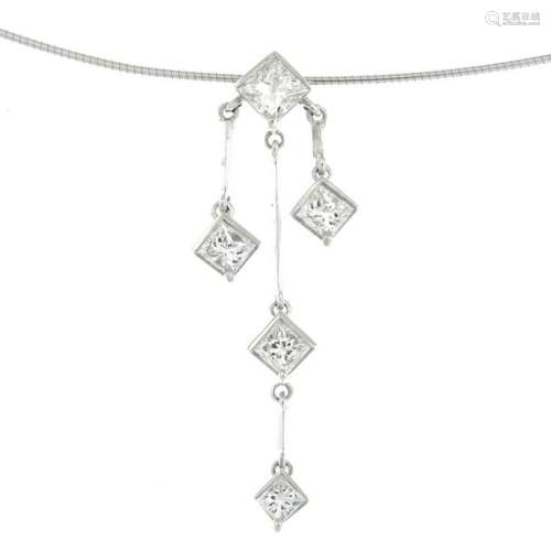 A triple drop diamond pendant, suspended from an 18ct