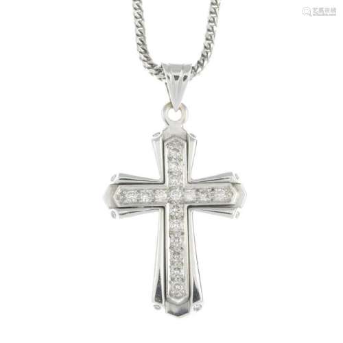 A brilliant-cut diamond cross pendant, suspended from a
