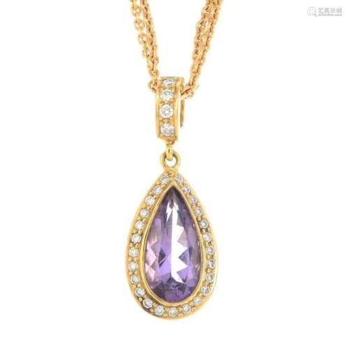 An amethyst and diamond pendant, suspended from a