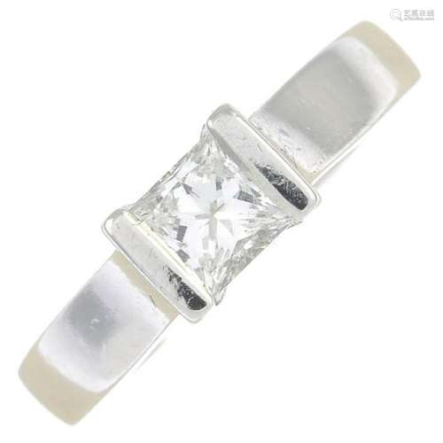 A platinum square-shape diamond single-stone ring.Laser