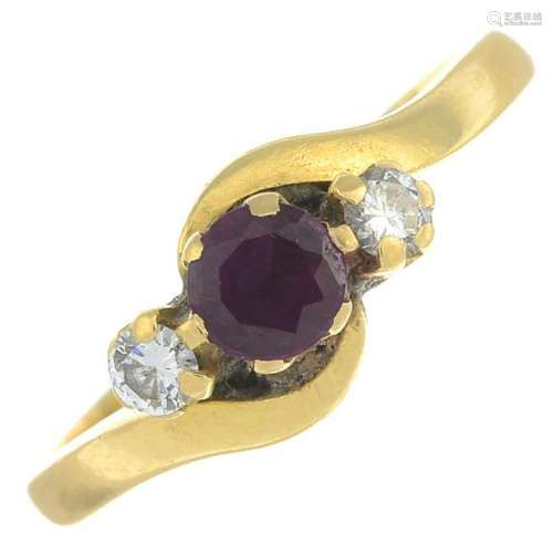 An 18ct gold ruby and diamond crossover ring.Estimated