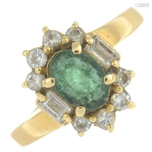 An emerald and diamond cluster ring.Estimated total