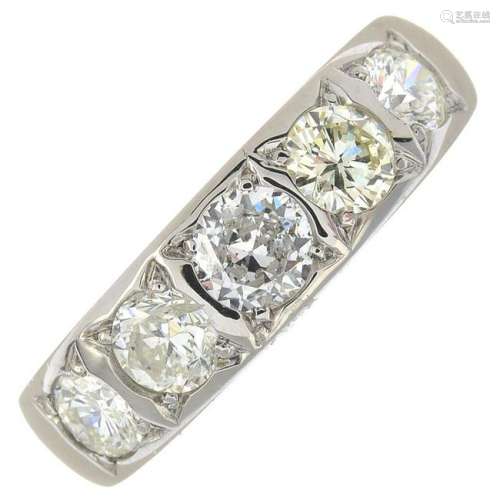 A diamond five-stone ring.Estimated total diamond