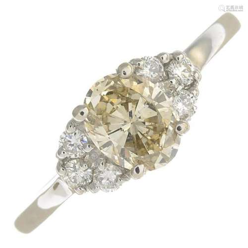 An 18ct gold 'coloured' diamond and diamond ring.